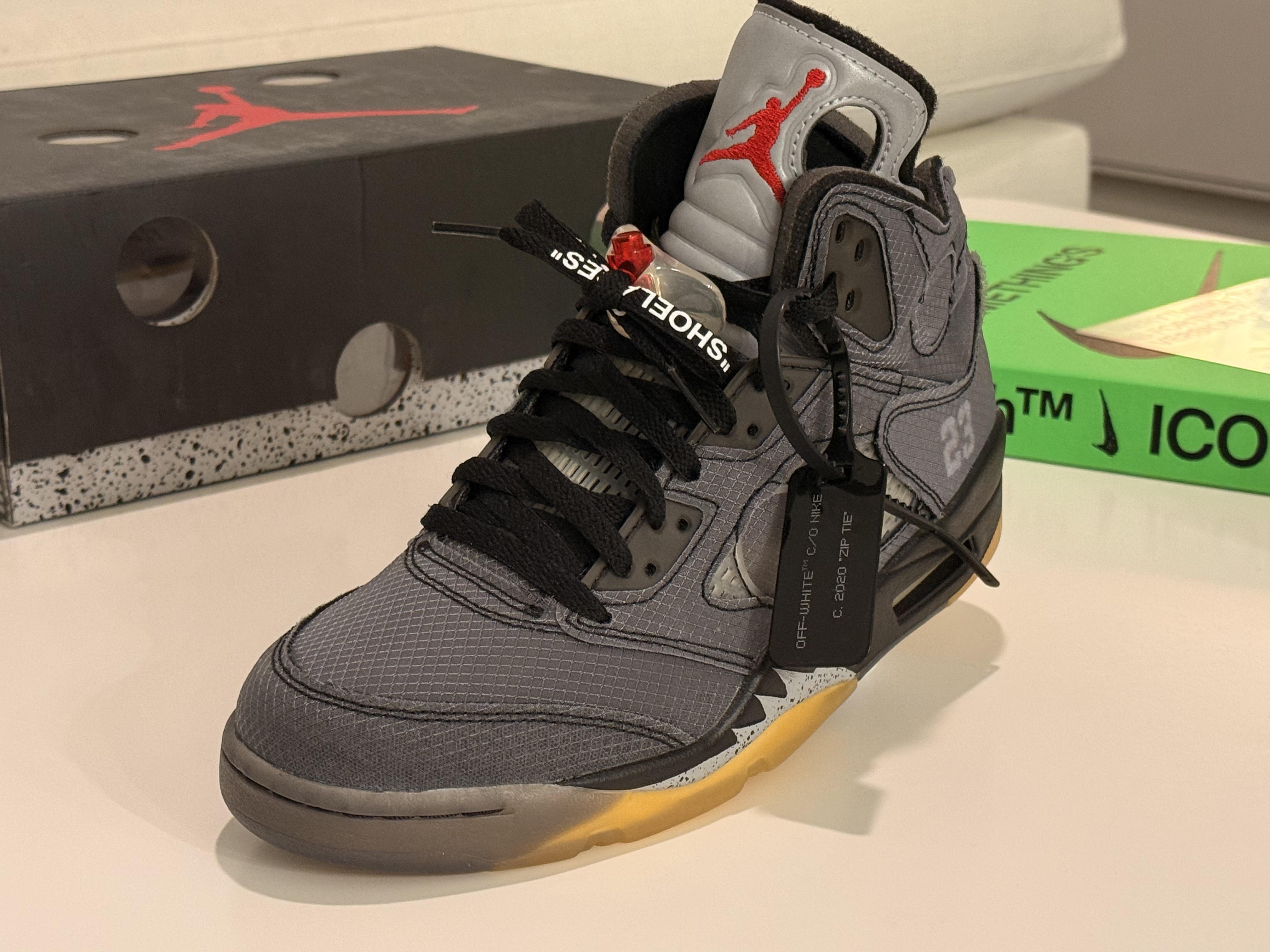 Jordan 5 Off-White Muslin detail — zip tie and lace hardware